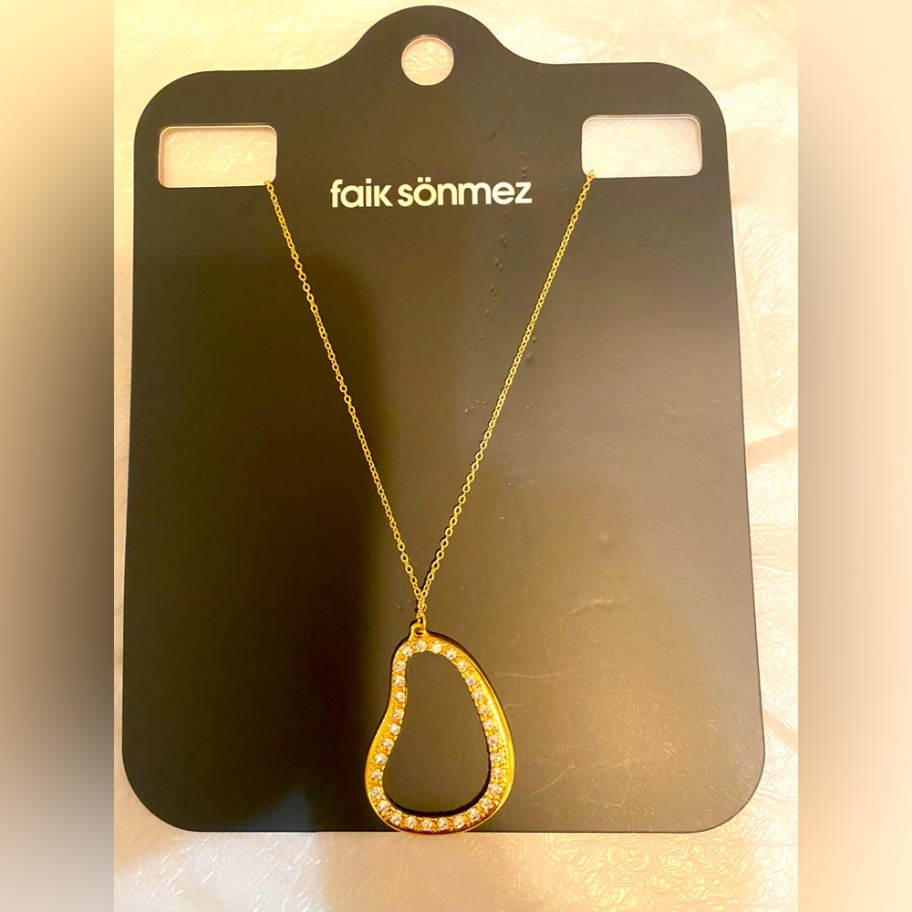 New Faik Sonmez necklace with glittery pendant .